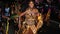 A black woman dressed as an Amazon warrior at Junkanoo.