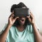 Black woman experiencing virtual reality with a VR headset