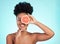 Black woman, face and smile with grapefruit for skincare nutrition, beauty or vitamin C against a blue studio background