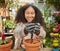 Black woman, garden and soil with plant and environment, happy gardener with dirt and nature, growth and sustainability