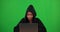 Black woman, green screen or portrait of thief hacker in cybersecurity, information technology on laptop. Evil smirk