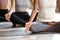 Black woman and group of people practicing yoga, Half Lotus