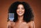 Black woman, hair care and smile in portrait with comb, afro pick or beauty against brown backdrop. Happy African, model