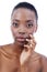 Black woman, hand on face and natural beauty, dermatology and skincare with glow and wellness on white background