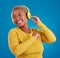 Black woman, headphones and listening to music with a smile in studio while happy streaming audio. African female model