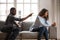 Black woman and man quarrelling at home