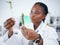 Black woman, medical science and plant sample in research laboratory, analytics and medicine. Woman, doctor or scientist