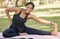 Black woman, portrait and stretching legs for park exercise, workout and relax training in nature. Happy girl, yoga