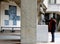 Black woman prays near statue of Saint Bernadette in Lourdes