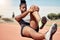 Black woman, runner stretching and training for race on racing track in stadium with focus, determination and motivation