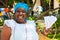 Black woman selling roasted peanuts in Havana