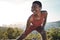 Black woman, stretching or fitness earphones in nature workout, training or exercise for healthcare wellness or marathon