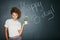 Black woman, studio portrait and holding plant with smile, beauty and celebration of birthday. Woman, teacher and