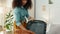 Black woman, suitcase and packing for travel in bedroom in home or vacation apartment. Luggage, clothes and happy