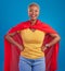 Black woman, superhero cape and portrait in studio, blue background and fashion. Happy female model, superwoman and