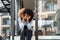 black woman waiter of street cafe is waiting for clients, customersm she is bored, no people in their cafe. small