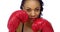 Black woman wearing boxing gloves