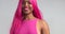 Black women dancing in pink wig