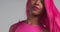 Black women dancing in pink wig
