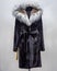 Black women`s mink fur coat with fluffy collar and belt