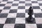 Black wooden bishop on chessboard