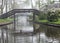 Black wooden bridges over the canal in Giethoorn (Netherlands)