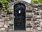 Black Wooden Door in Multicolored Stone Wall, Edinburgh