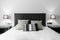 Black wooden headboard with matching bedside tables