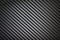 Black woven carbon fibre texture pattern background