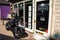 A black Yamaha motorcycle parked up outside a barbers in the town of Cromer, Norfolk