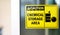 Black-yellow Chemical storage area Hazard Sign and symbol on the glass door, Caution for warning dangerous space in laboratory.