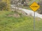 A black and yellow \'floodway\' sign depicting a floodway zone