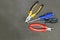 Black yellow pliers red nippers pair blue screwdriver repair base design on a dark background copy space
