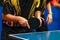 Black yellow shirt men playing double table tennis