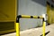 Black and Yellow street railing with Yellow doors