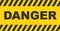 Black and yellow warning line striped background. Danger text sign.