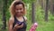 Black young woman using smartphone after jogging and shows green screen to the camera in slow motion