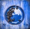 Blackberries in bowl on blue wooden background, top view