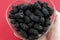 Blackberries in a Heart Shaped Glass Dish Filled Held by a Hand