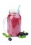 A blackberries pink drink, on a white background. Organic berry milk in a mason jar. Healthful smoothie.