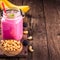 Blackberry banana cashew smoothie with copy space