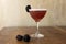 Blackberry cocktail with a wooden background