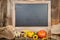 Blackboard in autumn with pumkins and sunflower