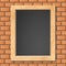 Blackboard on brick wall.