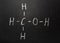 Blackboard chalk with the chemical formula of Methanol