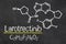 Blackboard with the chemical formula of Larotrectinib