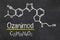 Blackboard with the chemical formula of Ozanimod