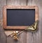 Blackboard empty decorated with dried flowers on the old wooden table