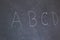 Blackboard with the first letters of the alphabet