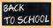 Blackboard frame with written back to school, school education concept